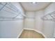 Walk-in closet with carpeted floor and wire shelving at 4036 Tullamore Ln, Auburndale, FL 33823