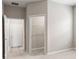 Bright room with neutral-toned carpet, with open doors to the closet and hallway at 715 Sw 77Th Cir, Ocala, FL 34474