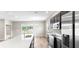 Modern kitchen with stainless steel appliances, dark cabinets, a large island, and hardwood floors at 715 Sw 77Th Cir, Ocala, FL 34474