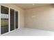 Covered patio with sliding glass doors overlooking the backyard at 715 Sw 77Th Cir, Ocala, FL 34474