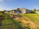 Lush backyard featuring landscaping and a screened porch, offering a private and tranquil retreat at 1155 Towergate Cir, Lake Wales, FL 33853