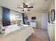 Bright bedroom with ceiling fan, view of the yard, and a well-lit interior at 1155 Towergate Cir, Lake Wales, FL 33853