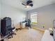 Bright bedroom with closet, gray carpet, and unique ceiling fan at 1155 Towergate Cir, Lake Wales, FL 33853