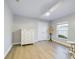 Clean bedroom with a large window, closet, and light hardwood flooring at 1155 Towergate Cir, Lake Wales, FL 33853