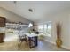 Bright breakfast nook features stylish pendant lighting, tile floors, and views to the backyard at 1155 Towergate Cir, Lake Wales, FL 33853