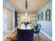 Stylish dining area featuring a wood table with seating and decorative wall accents at 1155 Towergate Cir, Lake Wales, FL 33853