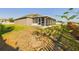Well-maintained home with a screened porch, a landscaped yard, and fresh exterior paint at 1155 Towergate Cir, Lake Wales, FL 33853