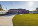 Inviting front exterior features lush lawn and tidy landscaping, complemented by a smooth driveway at 1155 Towergate Cir, Lake Wales, FL 33853