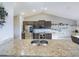 Modern kitchen featuring stainless steel appliances, granite countertops, and a double sink at 1155 Towergate Cir, Lake Wales, FL 33853