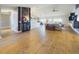 Open-concept living room with vaulted ceiling, wood floors, and comfortable modern furnishings at 1155 Towergate Cir, Lake Wales, FL 33853