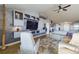 Open-concept living area with contemporary decor, a ceiling fan, and a spacious layout at 1155 Towergate Cir, Lake Wales, FL 33853