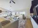 Spacious living room boasts hardwood floors, plush seating, and a modern entertainment center at 1155 Towergate Cir, Lake Wales, FL 33853