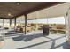 Relaxing screened patio with outdoor seating, a grill, and scenic views at 1155 Towergate Cir, Lake Wales, FL 33853
