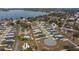 Aerial view showcasing the home's location and neighborhood near a lake at 1225 Third Ct, Eagle Lake, FL 33839