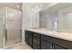 Bathroom boasts double vanity and walk-in shower at 1225 Third Ct, Eagle Lake, FL 33839