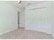 Simple bedroom with double door closet and carpet at 1225 Third Ct, Eagle Lake, FL 33839