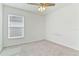 Spacious bedroom with window and ceiling fan at 1225 Third Ct, Eagle Lake, FL 33839