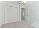 Simple bedroom with double door closet and carpet at 1225 Third Ct, Eagle Lake, FL 33839