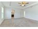 Spacious bedroom with ceiling fan and plush carpeting at 1225 Third Ct, Eagle Lake, FL 33839