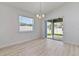 Bright dining room with sliding glass doors leading to the backyard at 1225 Third Ct, Eagle Lake, FL 33839