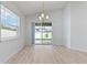 Bright dining room with sliding glass doors leading to the backyard at 1225 Third Ct, Eagle Lake, FL 33839