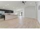 Open kitchen with dark cabinets, stainless steel appliances, and an island at 1225 Third Ct, Eagle Lake, FL 33839