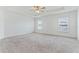Spacious main bedroom with neutral carpeting and ceiling fan at 1225 Third Ct, Eagle Lake, FL 33839
