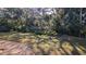 Lush backyard with mature trees and beautiful lawn, perfect for outdoor enjoyment and relaxation at 1610 Reynolds Rd # 211, Lakeland, FL 33801