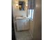 Bathroom vanity with sink, mirror, and vanity lighting at 1610 Reynolds Rd # 211, Lakeland, FL 33801