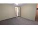 Bedroom with neutral colored carpet and a view to the hallway at 1610 Reynolds Rd # 211, Lakeland, FL 33801