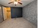 Bedroom showcasing neutral carpet, closet, and simple design at 1610 Reynolds Rd # 211, Lakeland, FL 33801