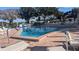 Inviting community pool with lounge chairs and clear blue water, perfect for relaxation and recreation at 1610 Reynolds Rd # 211, Lakeland, FL 33801