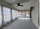 Sunroom featuring a ceiling fan, many windows and white walls at 1610 Reynolds Rd # 211, Lakeland, FL 33801