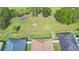 Aerial view of home showing neighboring properties and natural green space at 3226 Oak Tree Ln, Winter Haven, FL 33884
