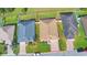 Aerial view of property showcasing the home, landscaping, and red boundary lines at 3226 Oak Tree Ln, Winter Haven, FL 33884