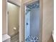 Modern bathroom featuring glass enclosed shower with gray and white tiling and flooring at 3226 Oak Tree Ln, Winter Haven, FL 33884