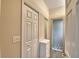 Bright bathroom with gray cabinets, white walls, tiled floor, and a glass-enclosed shower at 3226 Oak Tree Ln, Winter Haven, FL 33884