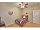 Charming bedroom with a baseball theme, featuring a twin bed and view of the door at 3226 Oak Tree Ln, Winter Haven, FL 33884