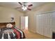 Neutral bedroom with baseball bed, ceiling fan and closet with double doors at 3226 Oak Tree Ln, Winter Haven, FL 33884