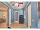 Flex room with blue walls, a safe, exterior doors and a window with wood blinds at 3226 Oak Tree Ln, Winter Haven, FL 33884