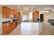 Open kitchen featuring granite countertops, stainless appliances and wooden cabinets at 3226 Oak Tree Ln, Winter Haven, FL 33884