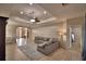 Open-concept living area featuring tile flooring, a comfortable sofa, and neutral walls at 3226 Oak Tree Ln, Winter Haven, FL 33884