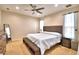 Spacious main bedroom with a ceiling fan, carpeted floors, and large windows at 3226 Oak Tree Ln, Winter Haven, FL 33884