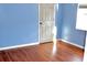 Light-filled bedroom with wood-look floors and light blue walls at 3709 Feather Dr, Lakeland, FL 33812