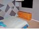 Bedroom with geometric wall art and dresser at 3709 Feather Dr, Lakeland, FL 33812