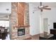 Brick fireplace with wood mantel in living room at 3709 Feather Dr, Lakeland, FL 33812