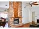 Brick fireplace with wood mantel in living room at 3709 Feather Dr, Lakeland, FL 33812