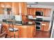 Open kitchen with granite counters and stainless steel appliances at 3709 Feather Dr, Lakeland, FL 33812