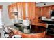 Kitchen features granite island and wood cabinets at 3709 Feather Dr, Lakeland, FL 33812