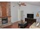 Spacious living room with a fireplace and hardwood floors at 3709 Feather Dr, Lakeland, FL 33812